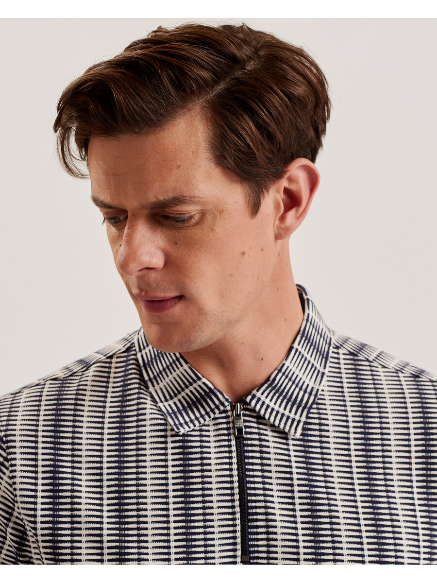 octon - geo-stribet poloshirt med lynlåsudskæring